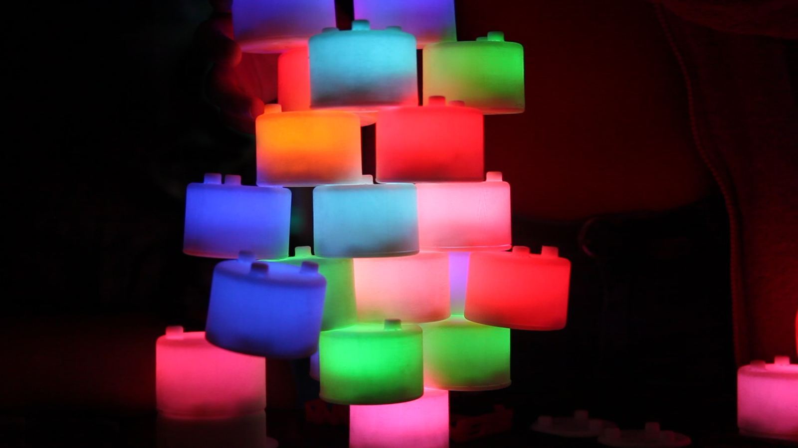 A stack of Tangeez. Each block is lit by how it connects to the blocks around it.