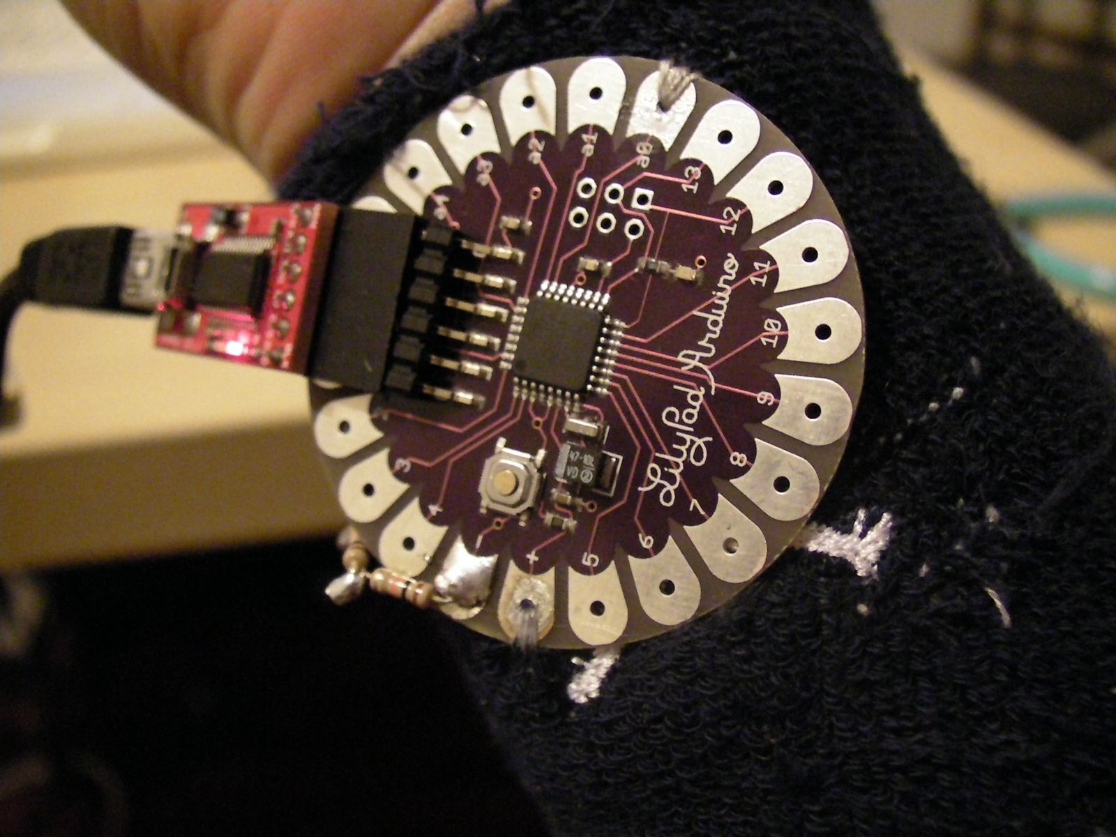 The LilyPad sewn into the wearable.